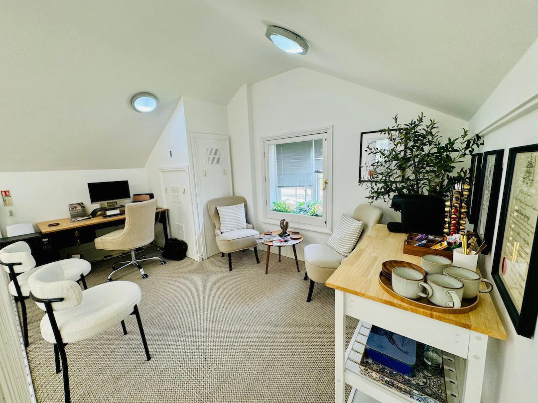 Photo of clinic office with desks and chairs